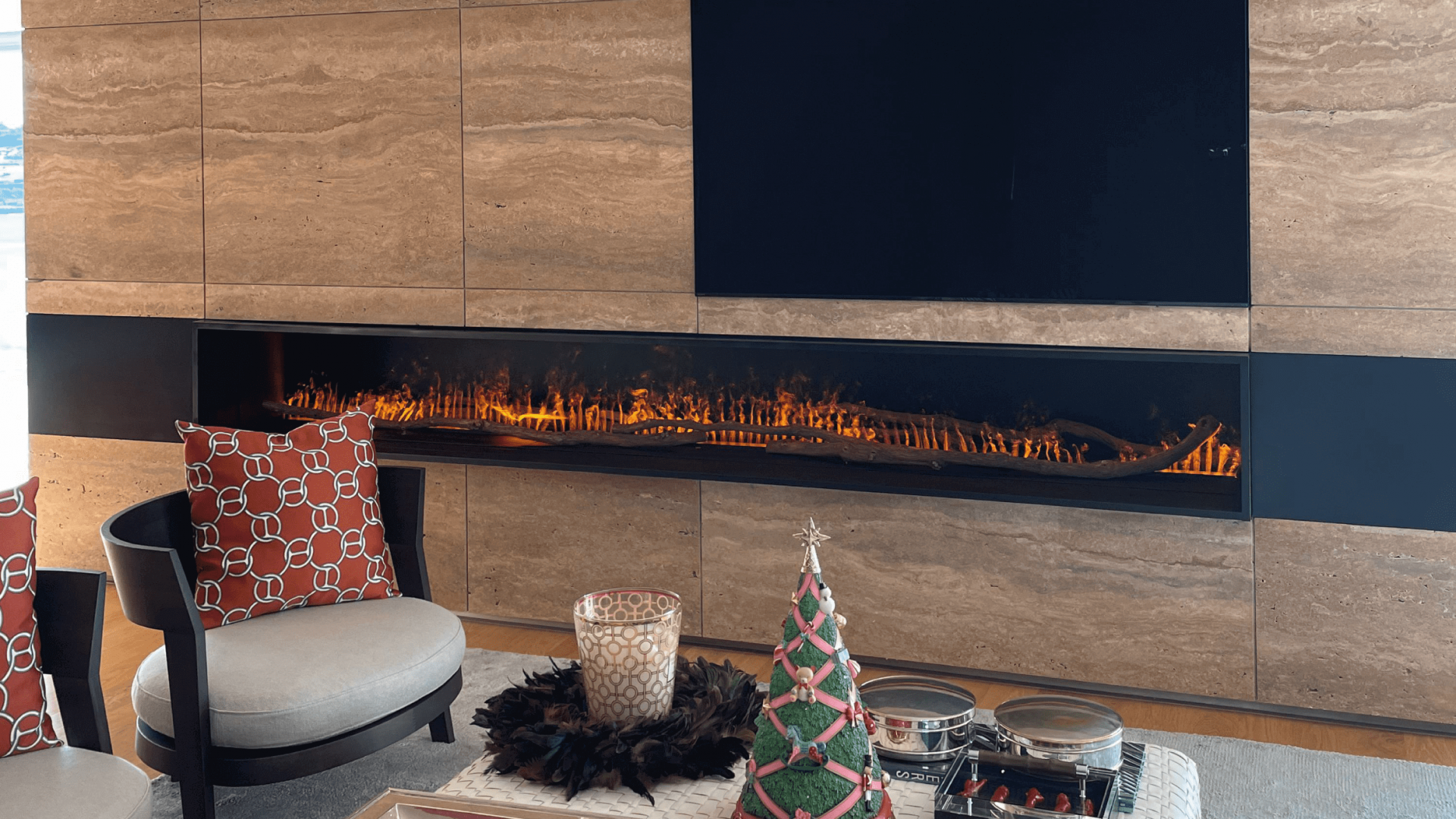 GlammBox electric fireplace by GlammFire in a modern living room with marble wall design.