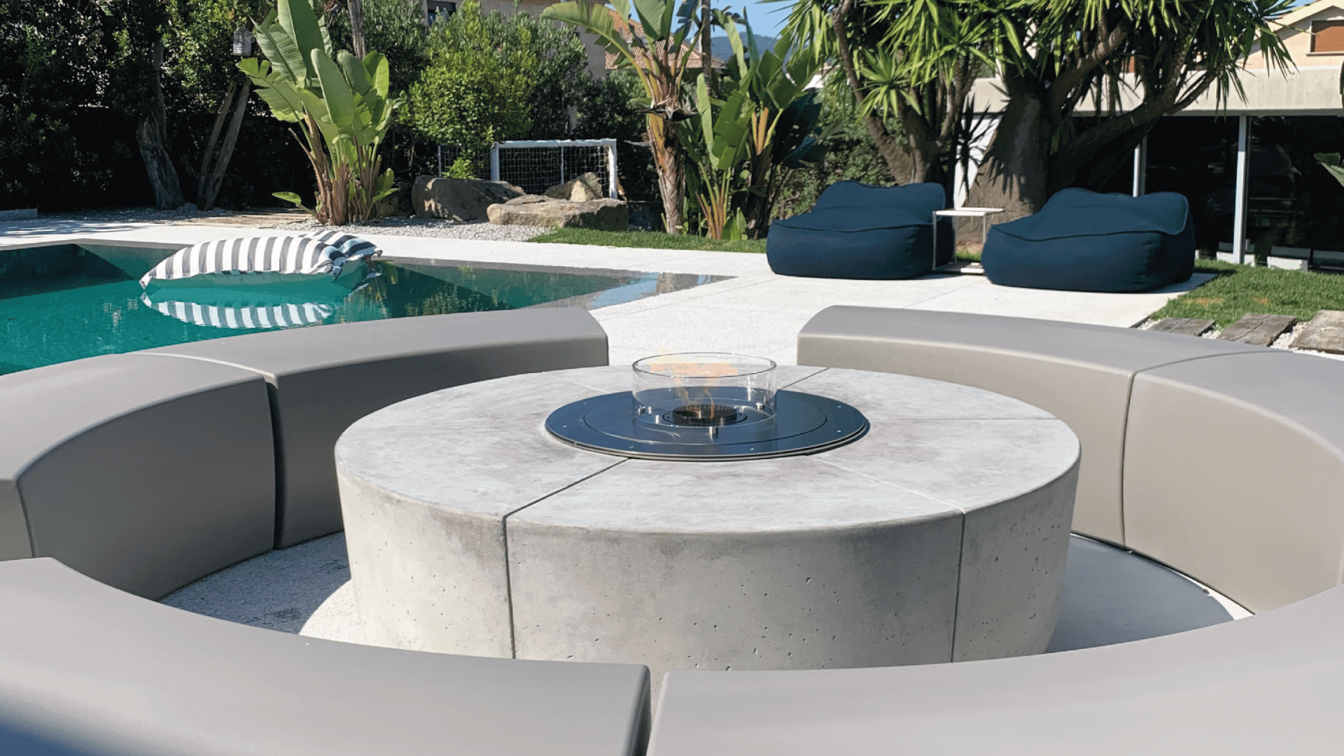 Zarzuela bioethanol fire pit by GlammFire in a modern outdoor seating area by the pool